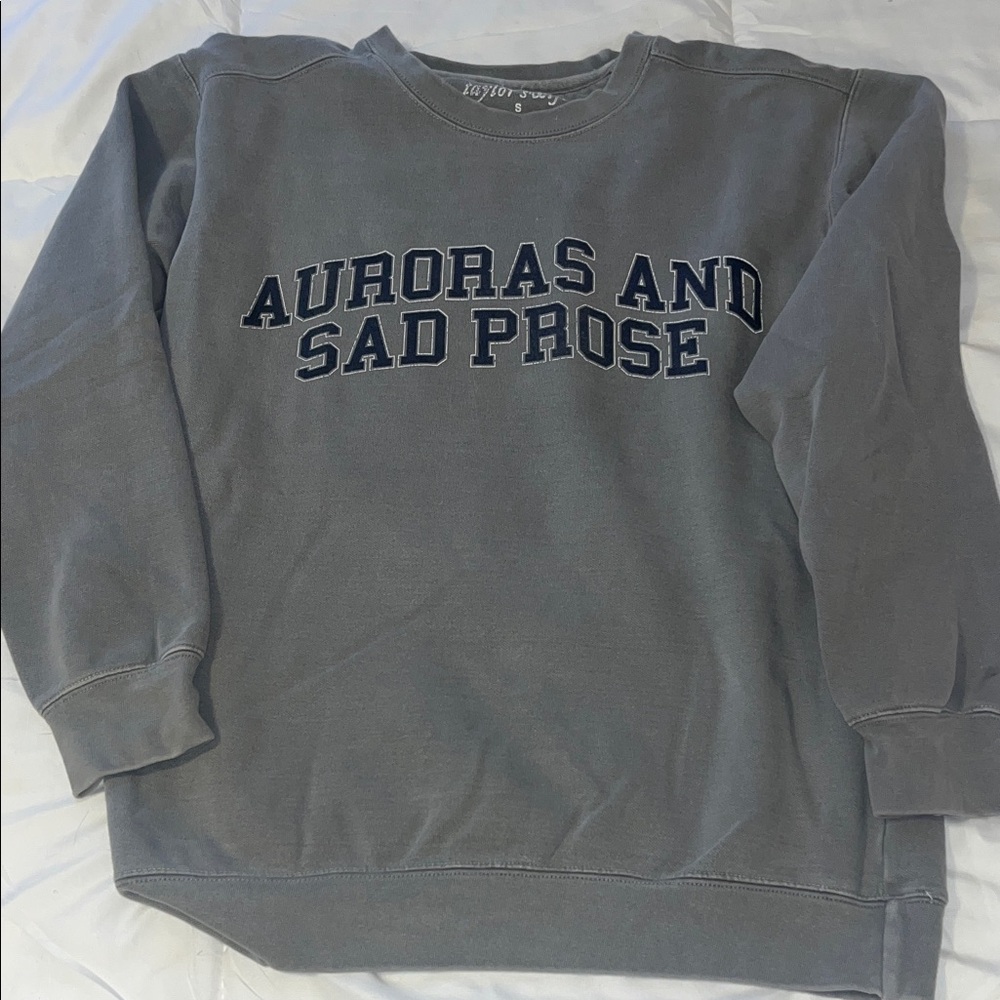 Taylor Swift Auroras and sad prose sweatshirt.
